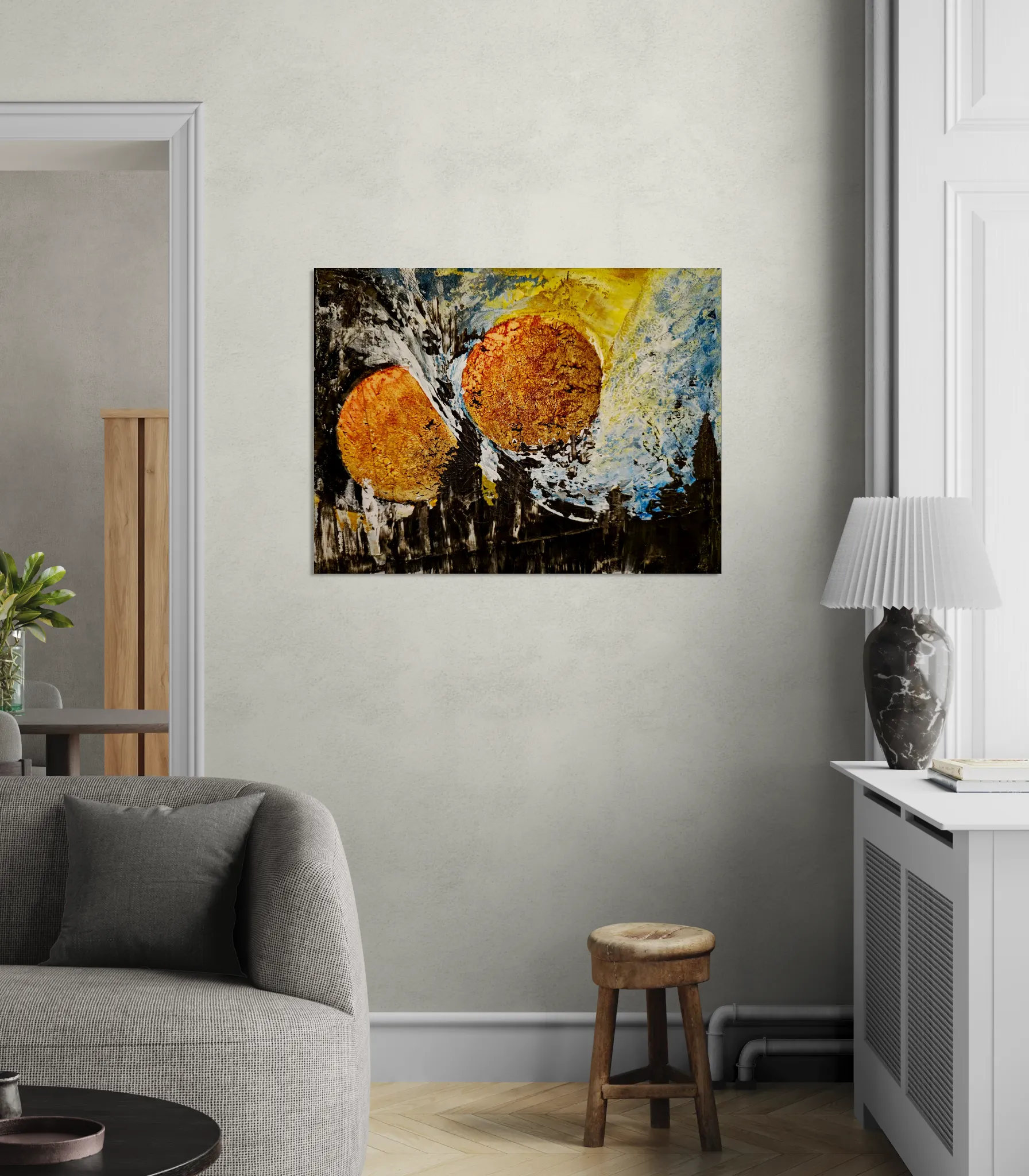 Bold and dark abstract landscape with orange, gold, blue and blackposter format displayed in a living space with grey wall and grey furniture