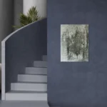 Monochromatic bold abstract portrait in greyscaleposter format displayed in a modern dark blue wall and staircase