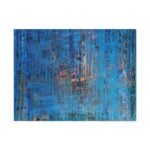 Layered and glowing abstract landscape in orange and blue canvas. Front view of the painting shown against a clean, neutral background to highlight color and detail