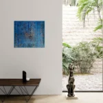 Layered and glowing abstract landscape in orange and blueoriginal format displayed in a modern interior space with glass wall and salon table