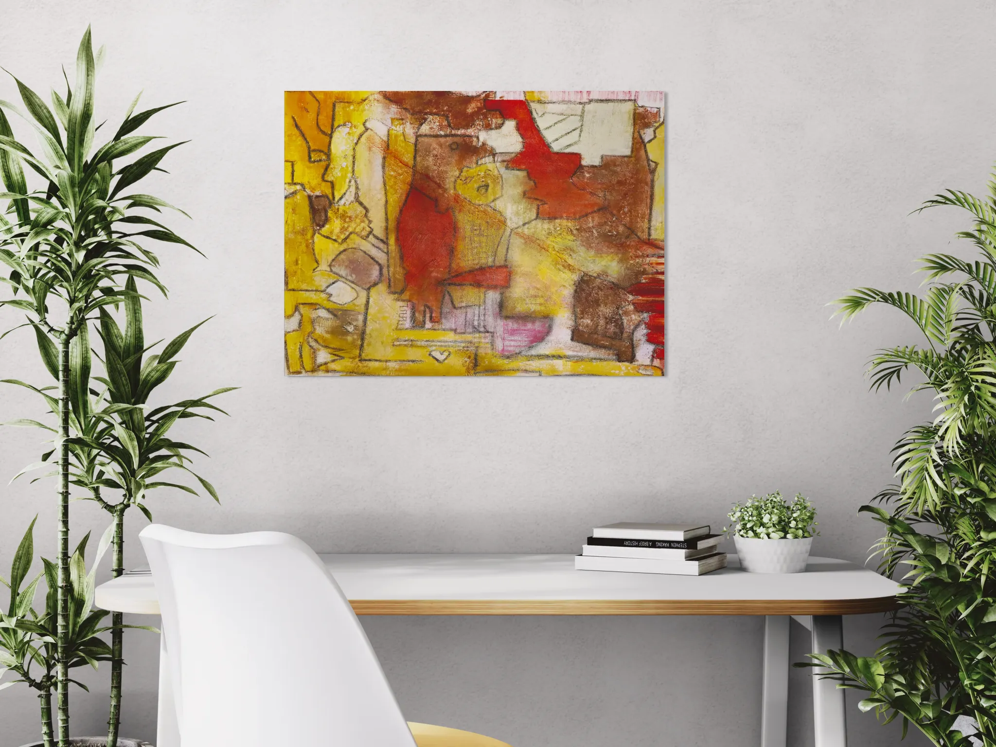 Warm conceptual abstract landscape with mustard yellow, red and brownposter format displayed in a white desk with decorative plants