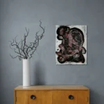 Dark and conceptual abstract portrait in white, black and redoriginal format displayed in a grey wall with wooden cabinet and vase with curly twicks