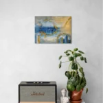 Dreamy glowing abstract landscape in blue and goldoriginal format displayed in a console table with speaker and potted plant