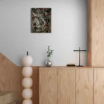 Geometrical, bold and dark abstract portrait in black, grey, white, brown, redoriginal format displayed in a wooden cabinet next to staircase