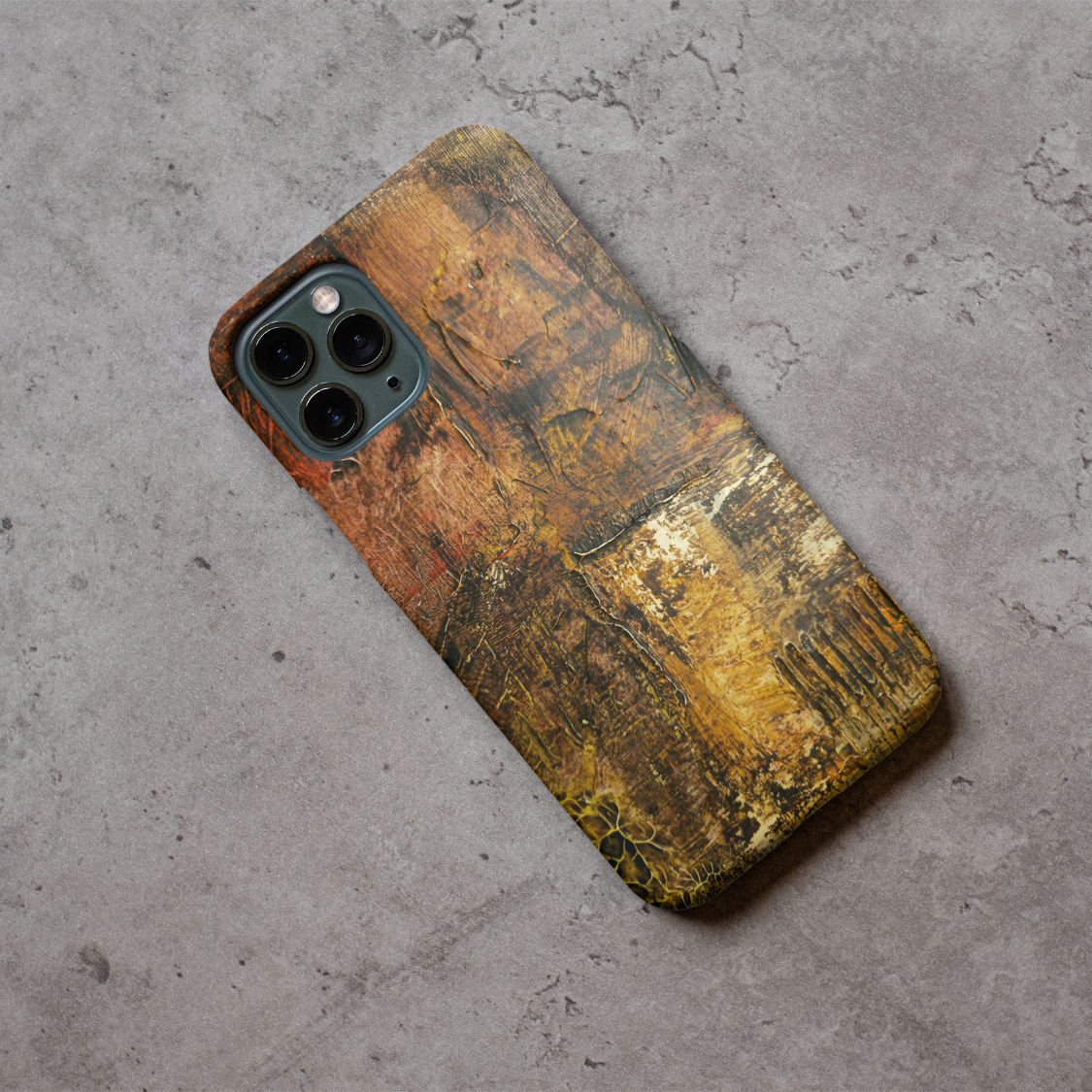 Phone case displayed on a grey concrete surface featuring the artwork “Amsterdam”, an earthy colored abstract artwork.