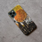Phone case displayed on a grey concrete surface featuring the artwork “Antwerp”, a blue and black abstract piece.