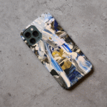 Phone case displayed on a grey concrete surface featuring the artwork “Buenos Aires”, a blue, white, and gold abstract piece.