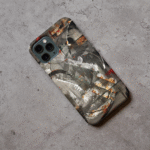 Phone case displayed on a grey concrete surface featuring the artwork “Paris”, a dark grey abstract artwork.