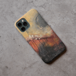 Phone case displayed on a grey concrete surface featuring the artwork “Winter is Coming”, an autumn colored, expressive abstract artwork.