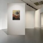 Abstract poster with autumn colors placed on art gallery wall