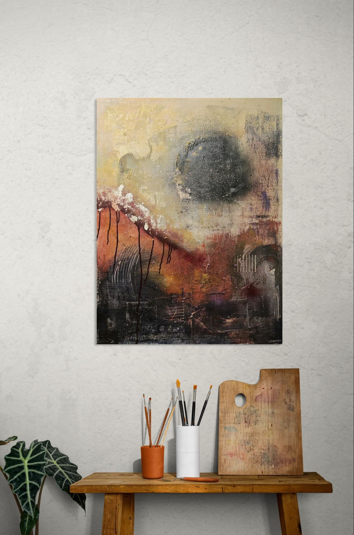 Abstract original painting with Bordeaux red and autumn light, a one-of-a-kind artwork behind artists side table with brushes and palette