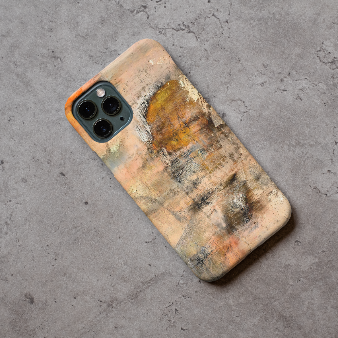 Phone case displayed on a grey concrete surface featuring the artwork “The Forgotten”, a warm abstract piece with a silhouette of a face.