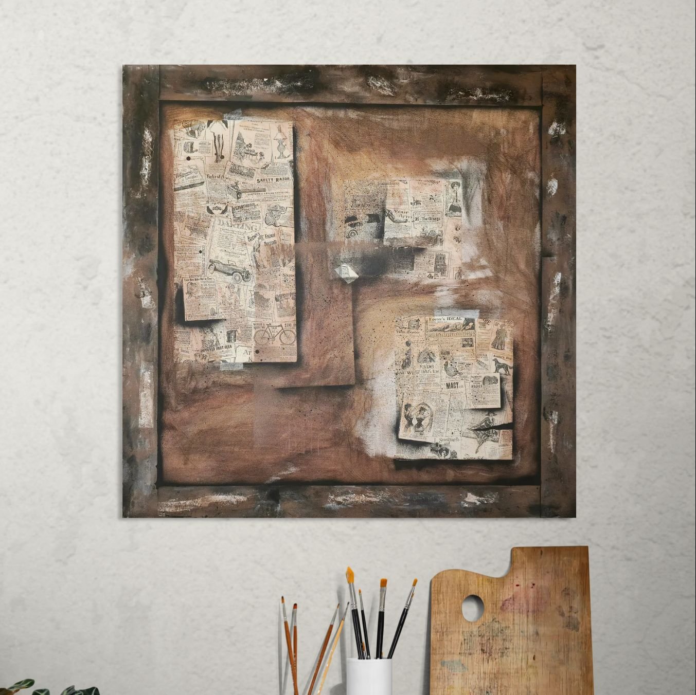 Hyperreal painting of a square old bulletin board with layered torn papers, rust stains, and a painted frame, all flat on canvas. Displayed in an art studio behind art supplies.