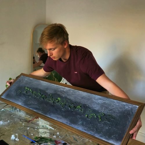 Ruben van Stegeren, founder of ARTvS, working on a painting in his artstudio